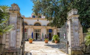 an entrance to a house with an iron gate at Casa Mariuccia in Anzio