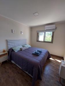 Ένα ή περισσότερα κρεβάτια σε δωμάτιο στο Complejo Vista Tres Picos