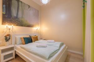 Postel nebo postele na pokoji v ubytování GDE Király 51