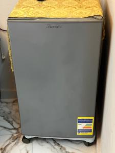 a metal refrigerator sitting on top of a counter at Star Vysta pyramids hotel in Cairo