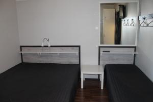 a bathroom with a sink and a mirror at Oulunsalo Apartment in Oulunsalo
