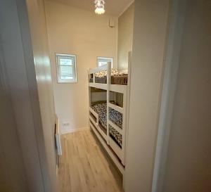 a hallway with bunk beds in a room at Lovely apartment with parking on closed premises. in Pärnu