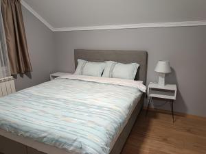 Postel nebo postele na pokoji v ubytování Apartman Ana