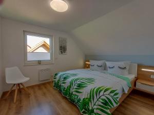 Postel nebo postele na pokoji v ubytování Ferienhaus Kari