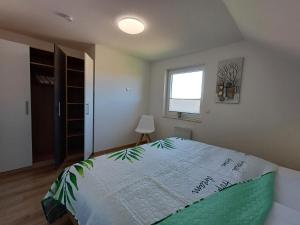 Postel nebo postele na pokoji v ubytování Ferienhaus Kari