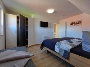 Postel nebo postele na pokoji v ubytování Ferienhaus Kari