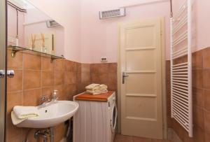 a bathroom with a sink and a mirror at Spacious & Smart Center Apartment in Pula +32 photos