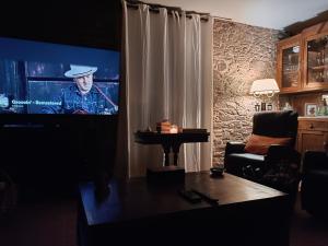 TV a/nebo společenská místnost v ubytování A Casa do Ferrador