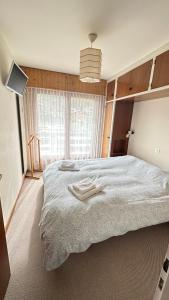 Ліжко або ліжка в номері Appartement lumineux & central