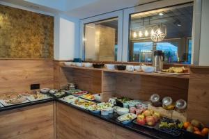 a buffet line with many different types of food at Hotel Polonia PARK Medical Center & Spa in Busko-Zdrój