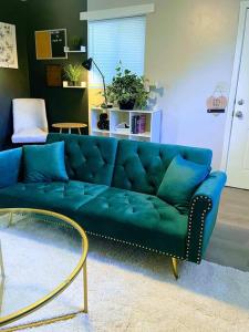 a blue couch sitting in a living room at The Getaway at Palm Dr in Atlanta