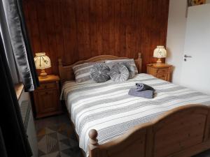 a bedroom with a bed with a stuffed animal on it at Kuća za odmor Elf in Kupjak