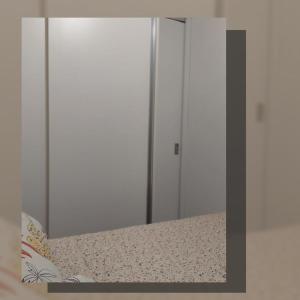 a mirror on a shelf in a room at Apartamento com piscina, apenas 200 metros do mar in Capão da Canoa +12 photos