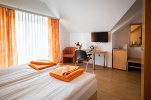 Postel nebo postele na pokoji v ubytování Penzion Kovac