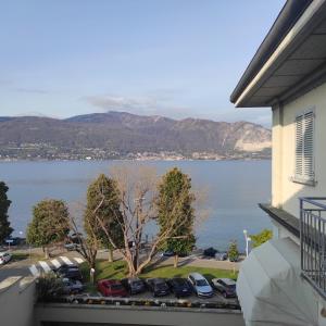 a view of a large body of water from a balcony at Residenza Le Magnolie in Verbania