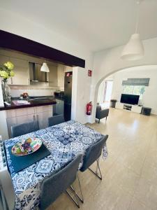 a table with a plate of food on it in a kitchen at Stunning mountain views! Private Villa with fabulous communal pool! in Murla