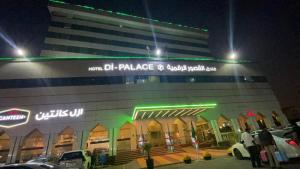 a building with cars parked in front of it at night at Hotel Di-Palace in Riyadh