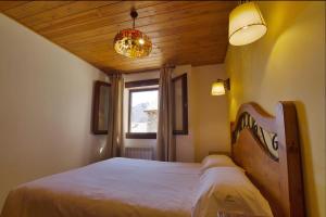 A bed or beds in a room at Apartaments La Peguera II