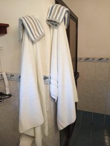 two towels hanging on a wall in a bathroom at Quinta Esencia in Brasilito