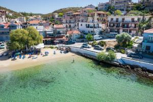 an aerial view of a beach and a city at Studios TOUTOULA in Skala Marion