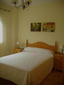 Ένα ή περισσότερα κρεβάτια σε δωμάτιο στο Duplex en Navajas (Castellón)