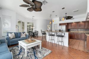 a living room with a couch and a table at Manatee Manor in Marco Island +42 photos