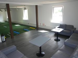 a living room with a couch and a table at Apartmány u golfu in Jihlava