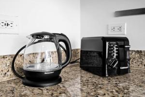 a blender sitting on a counter next to a toaster at Duplex 2BR in Miami