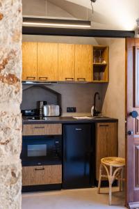 A kitchen or kitchenette at EliteDIMension Chalki Még 32 kép