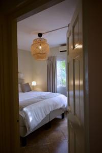 a bedroom with a large bed and a window at Luxury appt for 6: mesmerizing Spanish water view in Jan Thiel