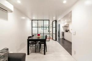 a kitchen and dining room with a table and chairs at Central Location Brooklyn Stay at Rem-Casa in Brooklyn +4 photos