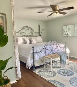 a bedroom with a bed and a ceiling fan at Cypress Retreat in Fort Myers