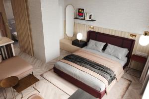 a rendering of a bedroom with a large bed at Residence Inn by Marriott Geneva City Nations in Geneva