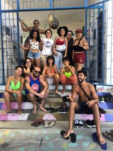 a group of people are posing for a picture at Hostel Das Canárias in Natal