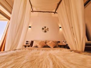 a bedroom with a large bed and a couch at Lucky palace Dahab in Dahab