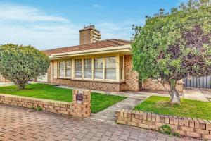 a house with a brick driveway in front of it at Waves and Walks - Close to Beach and Local Boutiques in Glenelg