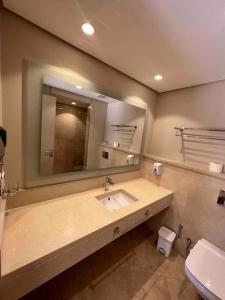 a bathroom with a sink and a mirror at One Bedroom - Mangroovy El Gouna in Hurghada