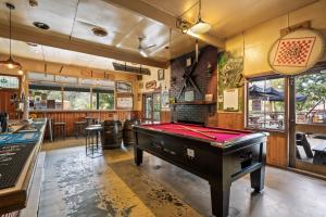 a pool table in a room with a bar at The Harrietville Snowline Hotel in Harrietville
