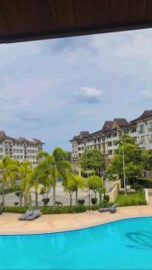 a view of a resort with palm trees and buildings at Davao 2br One Oasis Beside SM Mall-Wifi in Davao City