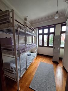 a room with two bunk beds and a rug at Easy Host Porto in Porto