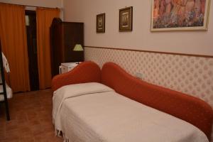 Postel nebo postele na pokoji v ubytování Il Borgo Agriturismo