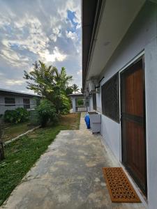 a walkway leading to the side of a house at Blissful Calm in Nadi