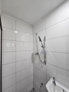 a bathroom with a shower and a sink at Blissful Calm in Nadi +32 photos