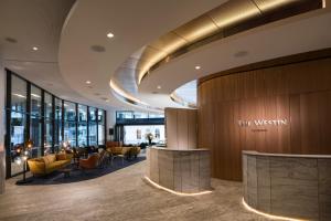 a lobby of the westin dublin with chairs and tables at The Westin Brisbane in Brisbane