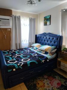 Ένα ή περισσότερα κρεβάτια σε δωμάτιο στο Jian's condotel @ 8 spatial
