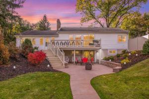 a white house with a porch and a patio at Arrowhead Riverfront Kayaks/Patio 30 Min to ND! in Bristol