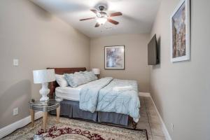 a bedroom with a bed and a ceiling fan at Gorgeous Home w/ Amazing View of Houston Skyline in Houston