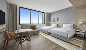 Postel nebo postele na pokoji v ubytování Hyatt Place Johor Bahru Paradigm Mall