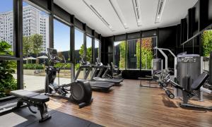 a gym with treadmills and cardio equipment in a building at Hyatt Place Johor Bahru Paradigm Mall in Johor Bahru