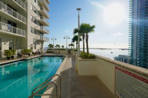 a swimming pool with a view of the ocean at 4 bed full condo in Miami with skyline & sea view in Miami